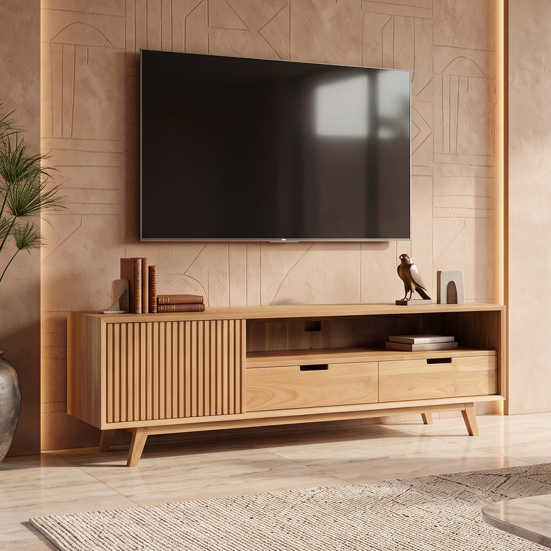 A light natural wood TV stand or media console with slatted cabinet doors, two drawers, and open shelving, shown in a styled living room setting with a wall-mounted TV, bowl, and rug.
